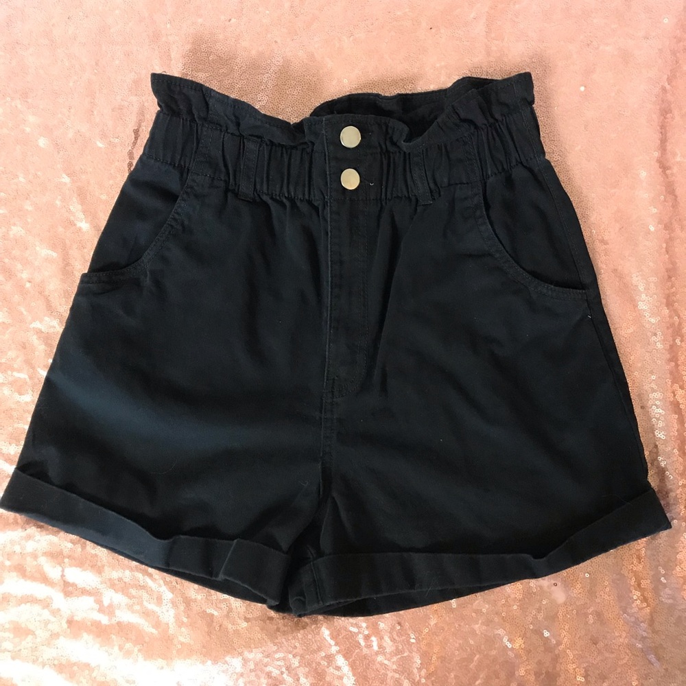 Black high waisted “paper bag” style shorts. Size 6